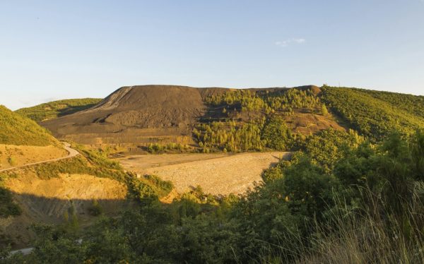 Landscape altered by coal mine waste dump of open pit retaining wall waste