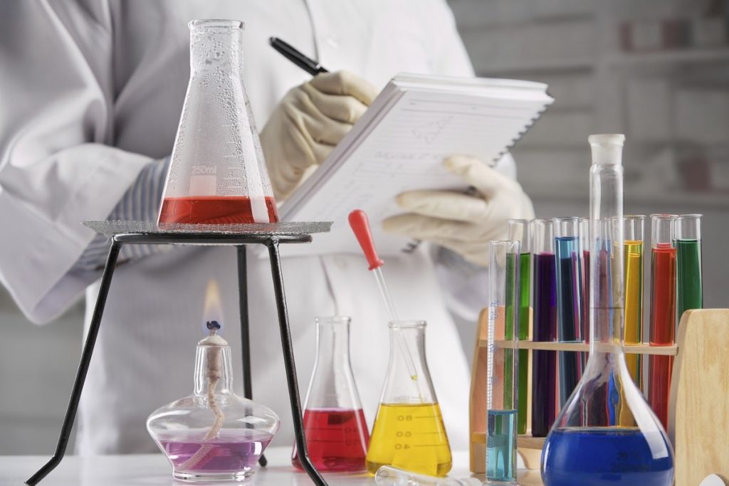 Scientist making notes in laboratory